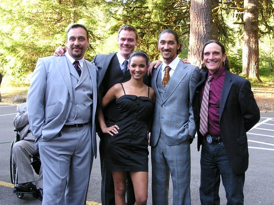 Family group dressed formally outdoors